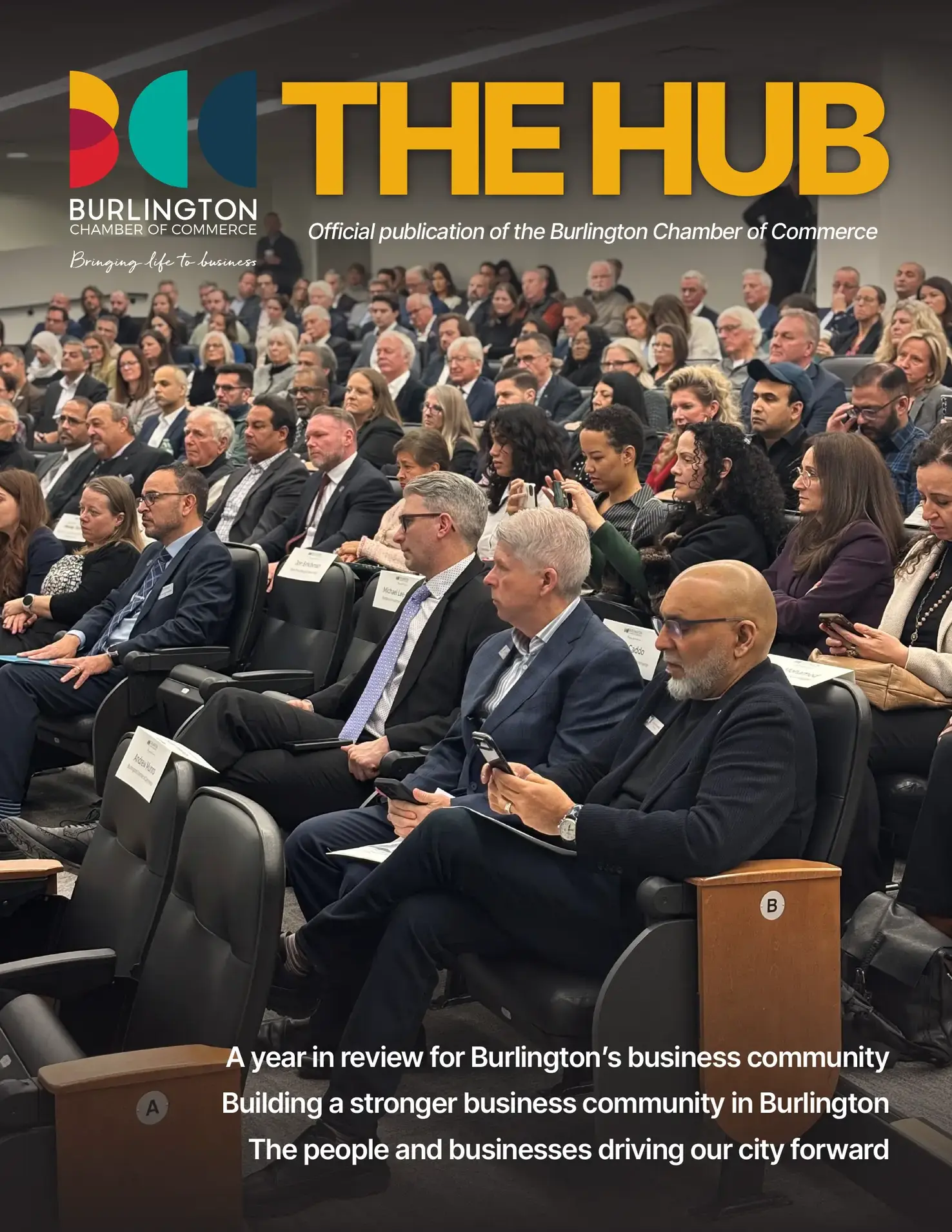 The Hub inaugural magazine cover featuring Burlington business leaders gathered at a Chamber event